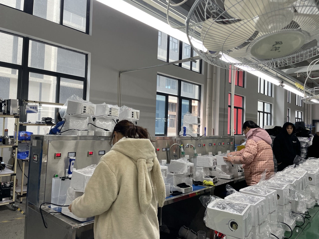 Inspection room performing final quality checks on coffee machines